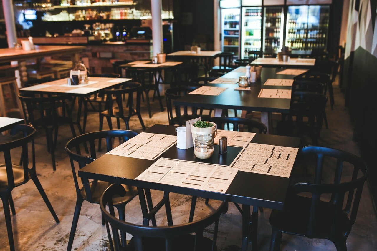 a restaurant with tables and chairs