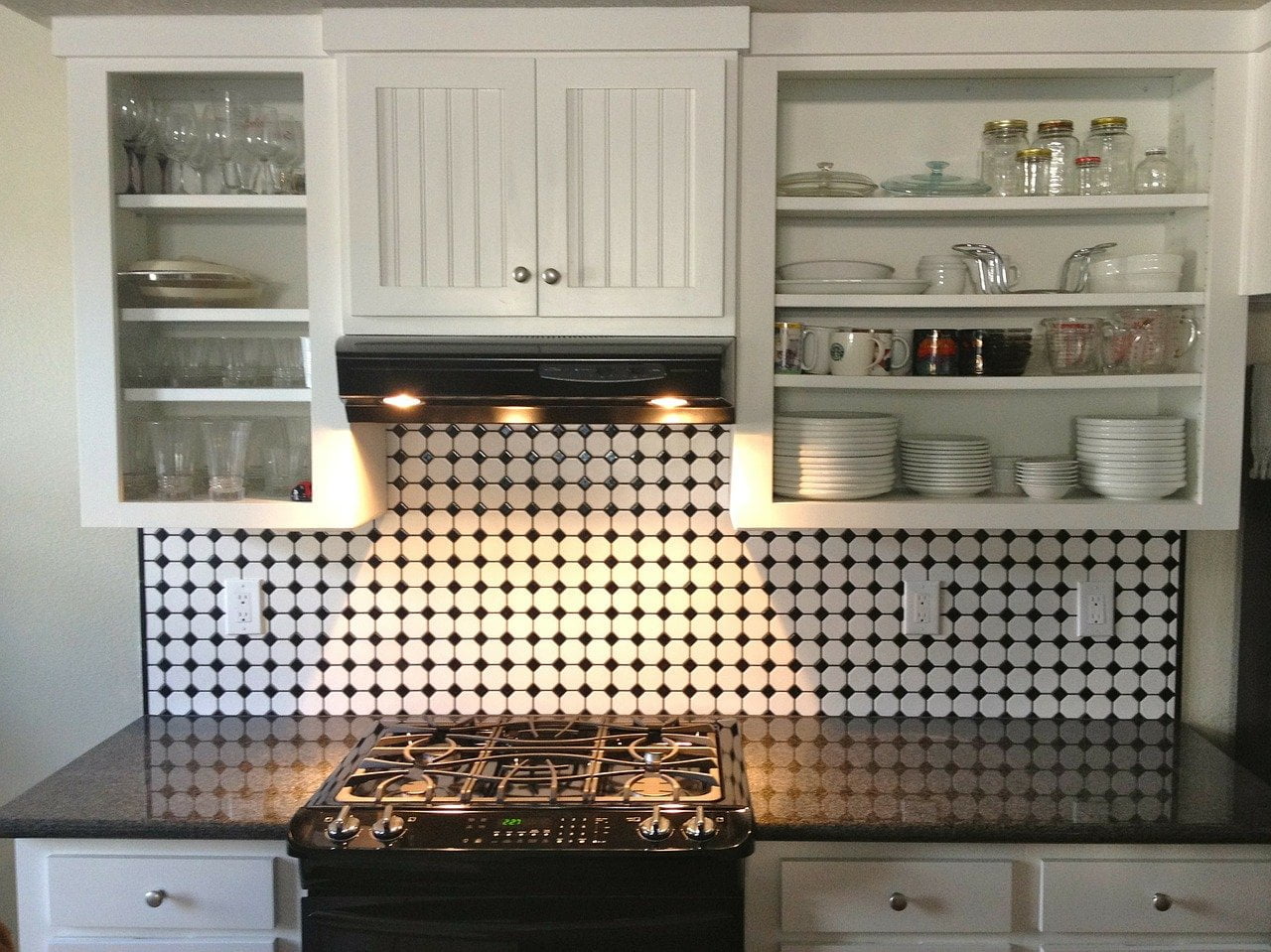 a kitchen with white cabinets